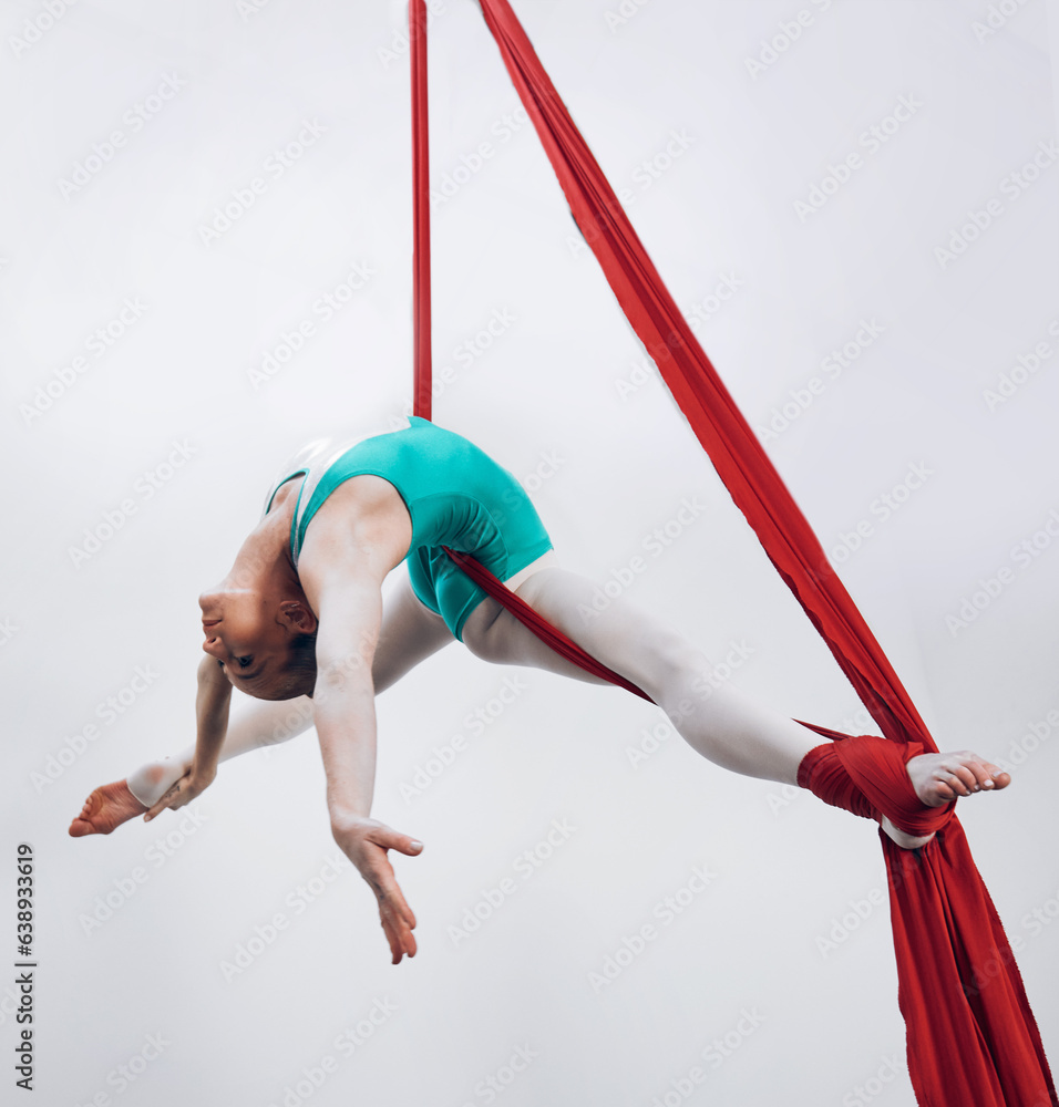 Aerial, woman gymnast and sport performance with stretching, flexibility and athlete with white back