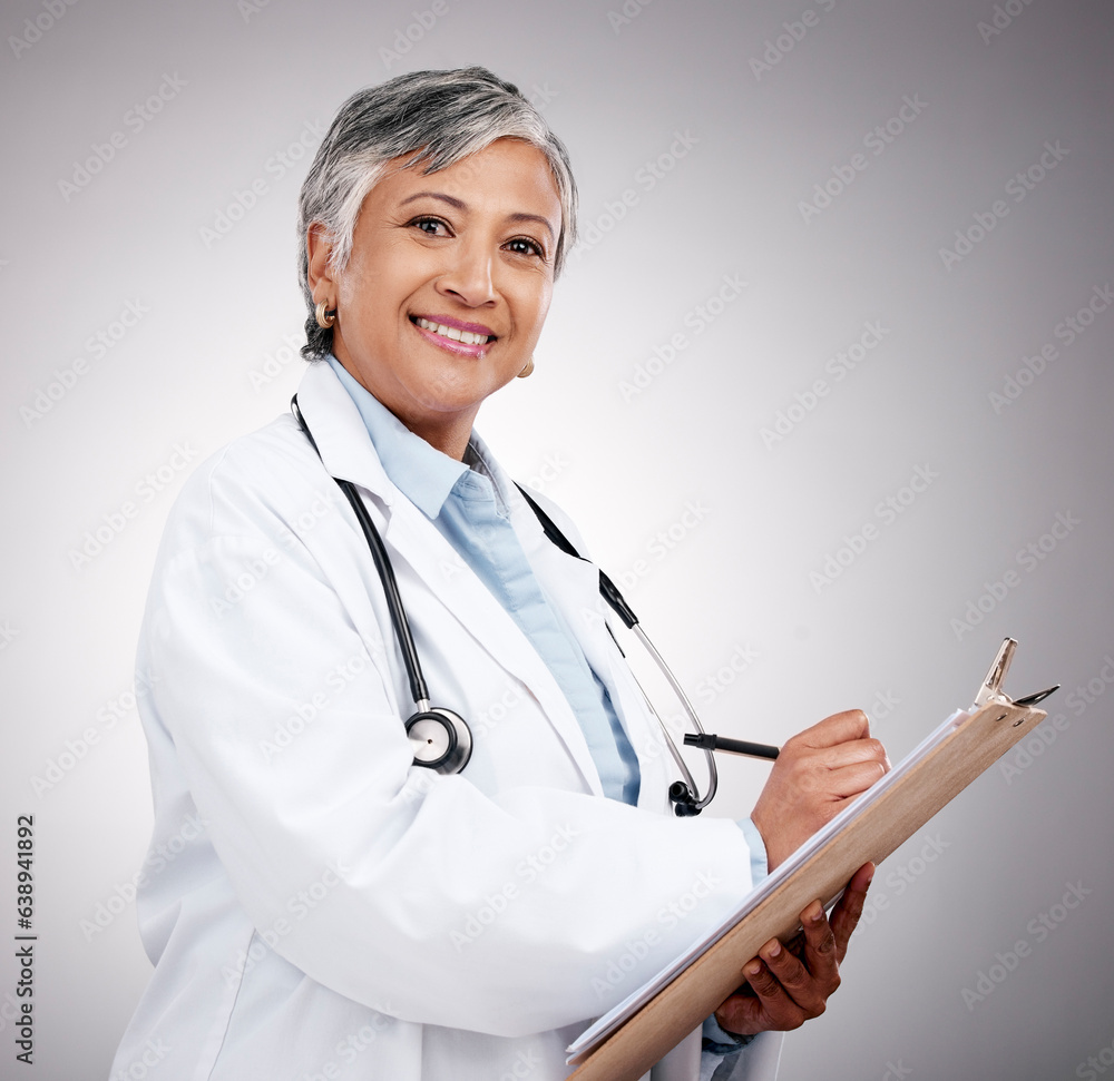 Happy woman, portrait and doctor with clipboard in studio, planning notes or healthcare information.