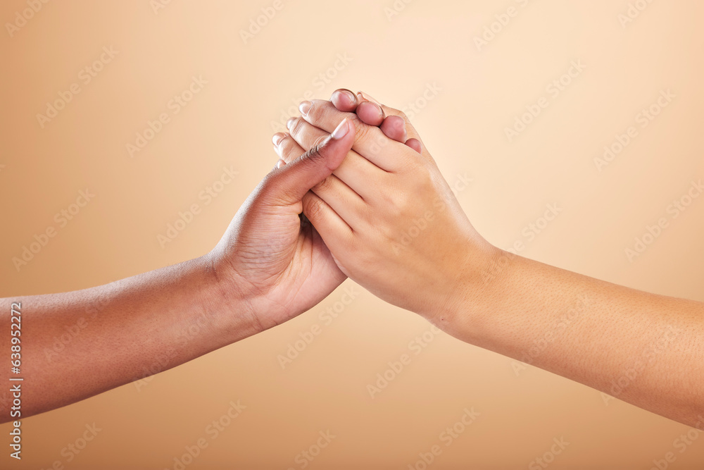 Beauty, skincare and support with women holding hands in studio on a beige background for community 