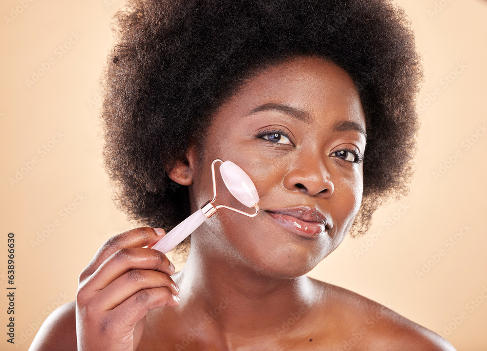 Black woman, face roller and portrait of beauty, rose quartz cosmetics and natural skincare on studi