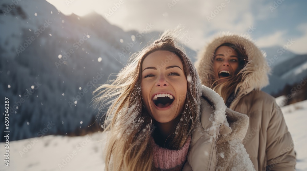 Three happy adult girls are having fun and throws first snow on background of mountains. Travel in w