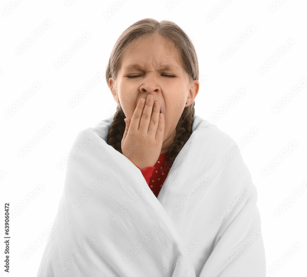 Sleepy little girl with soft blanket on white background