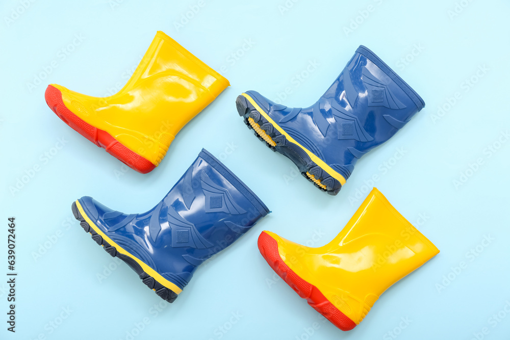 Different gumboots on blue background