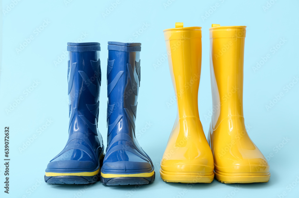 Different gumboots on blue background