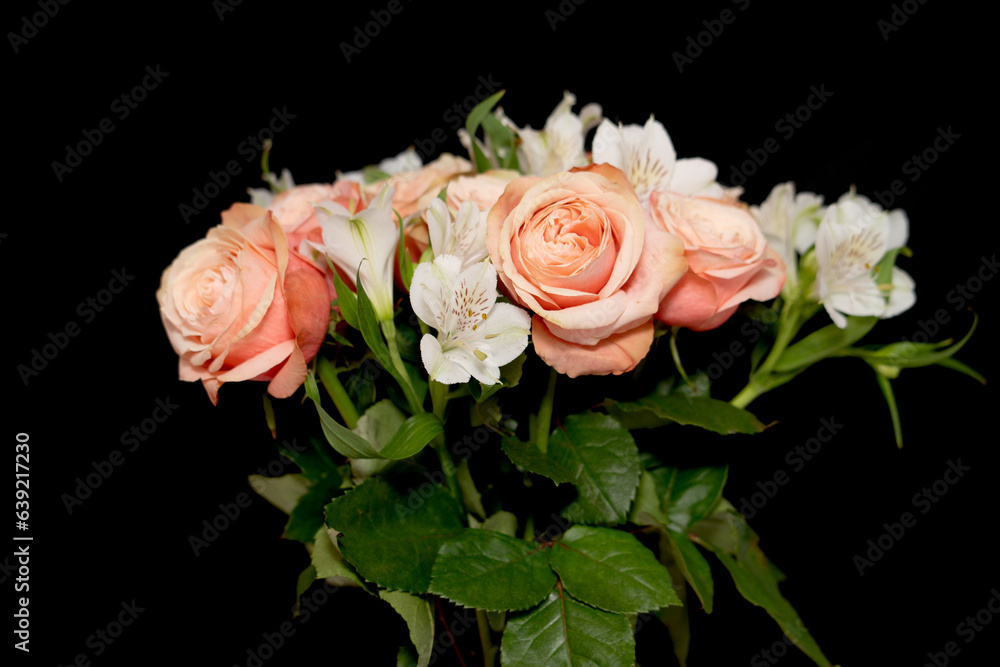 Bouquet of roses on a black background.