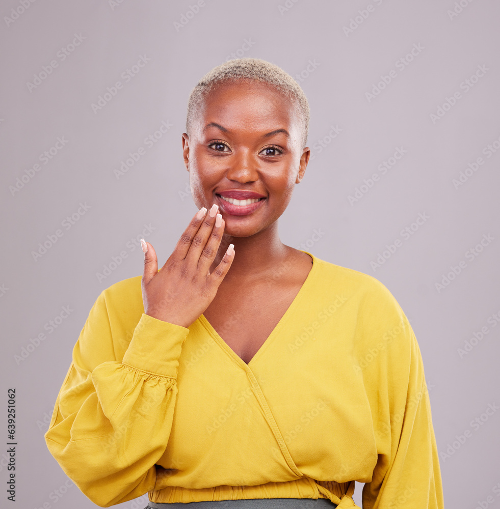 Smile, hand and portrait of a black woman on a studio background for a surprise, gesture or showing.