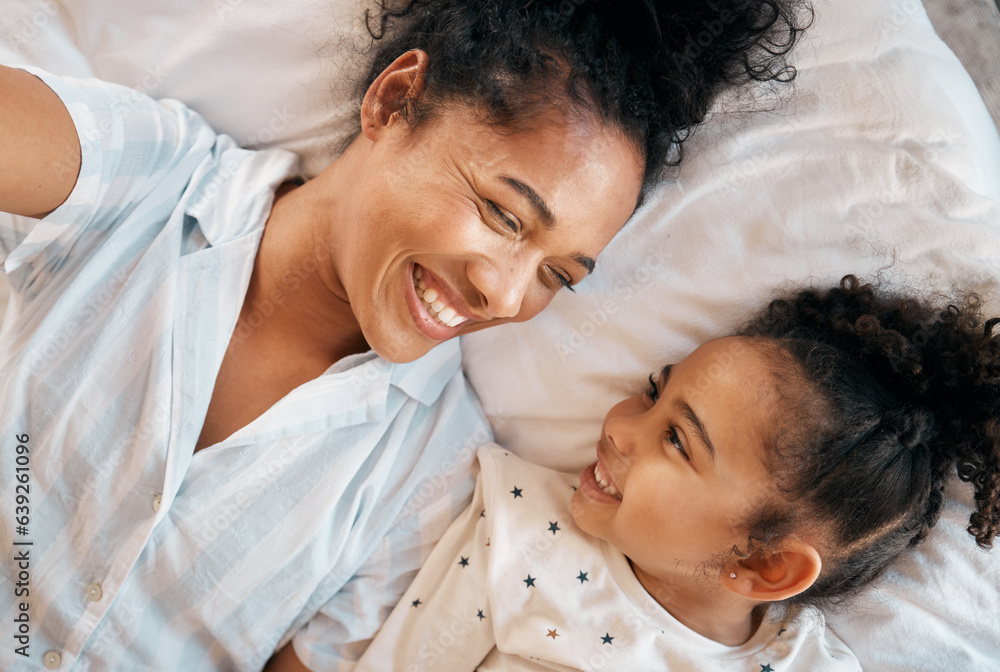 Selfie, top view and mother with girl child on a bed happy, bond and relax at home. Love, profile pi