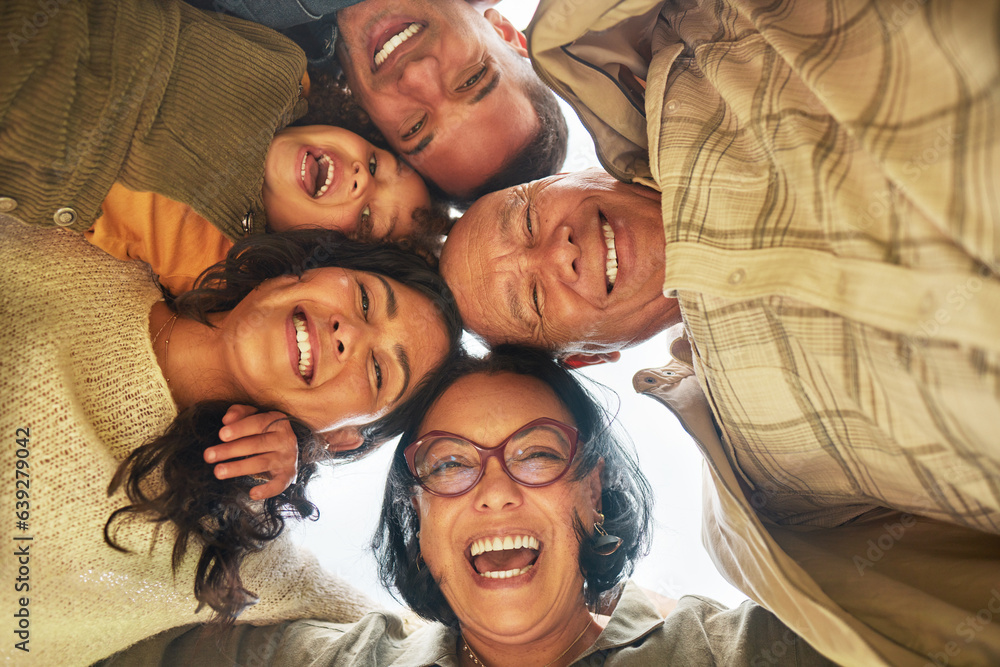 Family, park and portrait of hug below with happy, bonding and smile outdoor on vacation. Huddle, mo