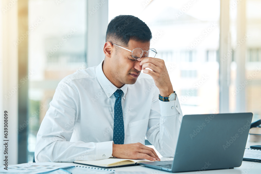 Business man, headache and stress on laptop for financial mistake, accounting error or results and p