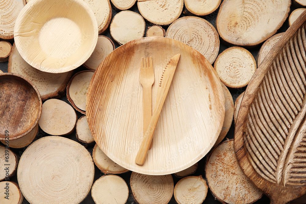 Different tableware on wooden background