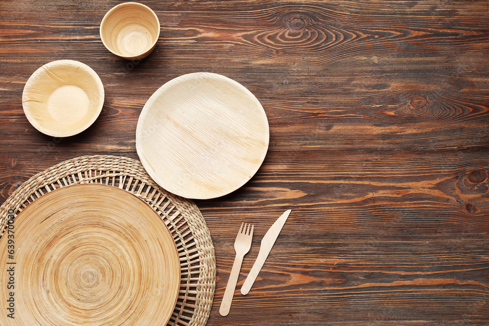 Different tableware on wooden background