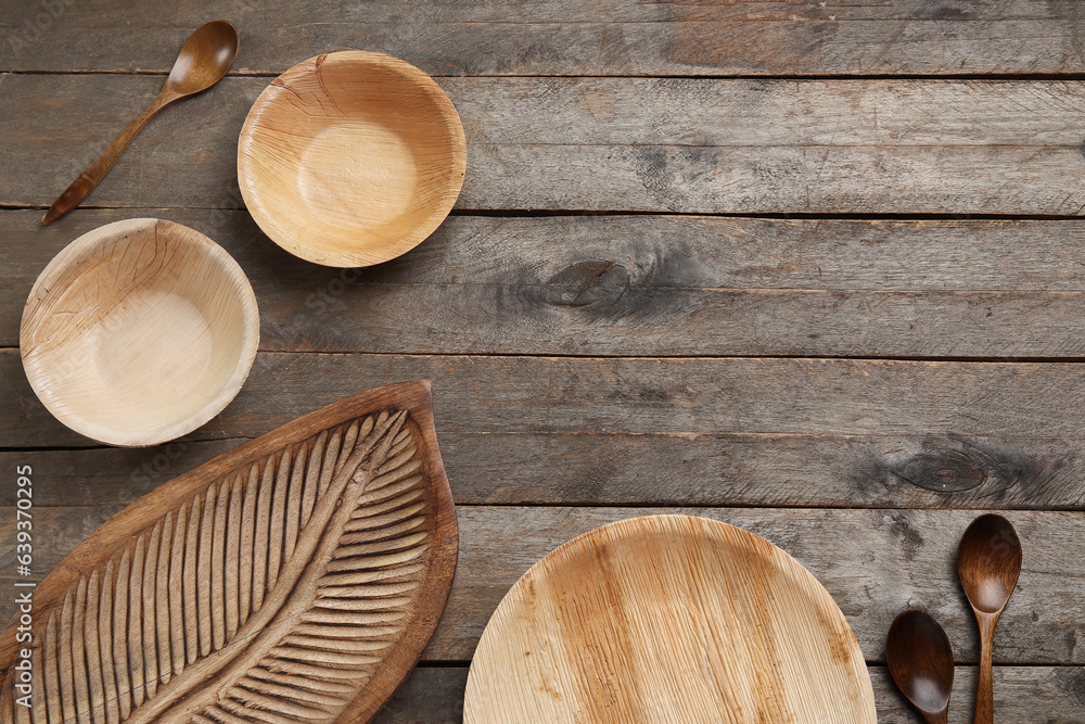 Different tableware on wooden background