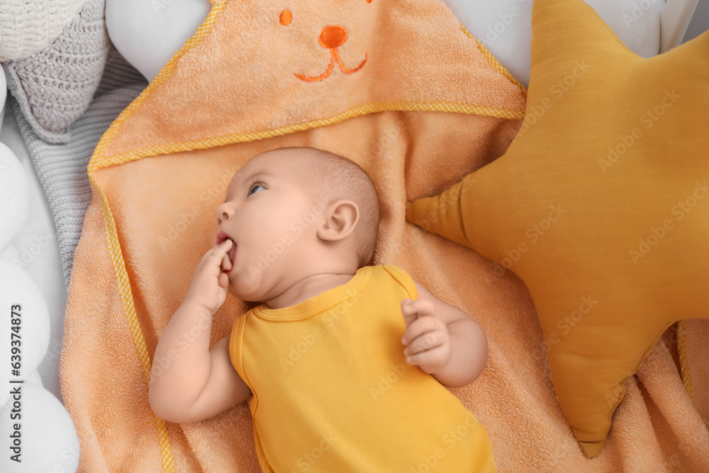 Cute baby lying in crib