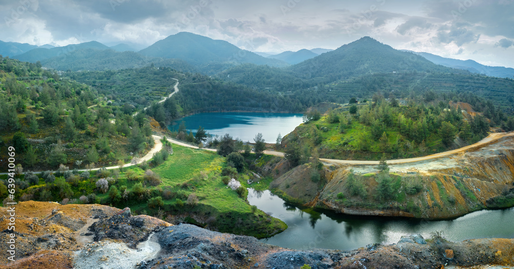 Abandoned mining area restoration in Cyprus. Panorama of open pit Memi sulphides mine with pit lake 