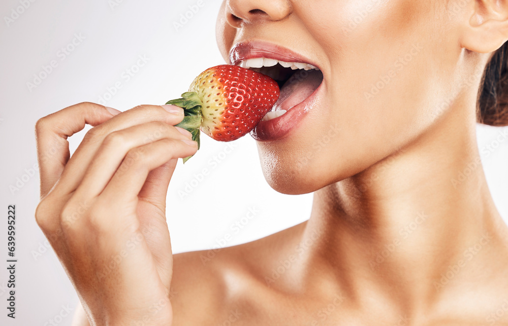 Woman, strawberry and mouth for eating, studio and healthy with nutrition, diet and bite by white ba