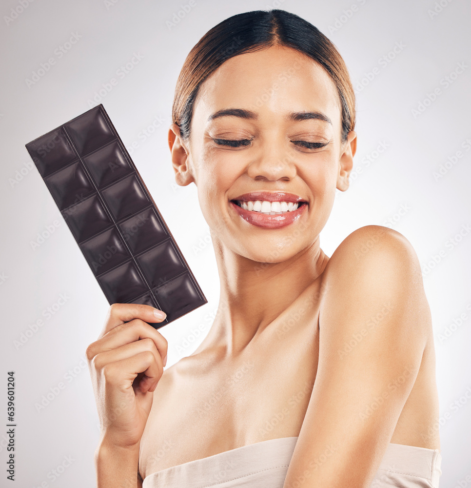 Woman, chocolate and thinking of diet for skincare, beauty and health or wellness on a white backgro