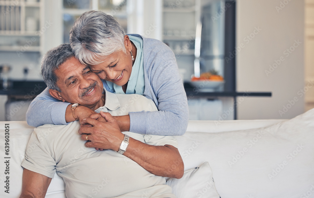 Senior couple, hug and love in care, support or embrace and bonding on living room sofa together at 