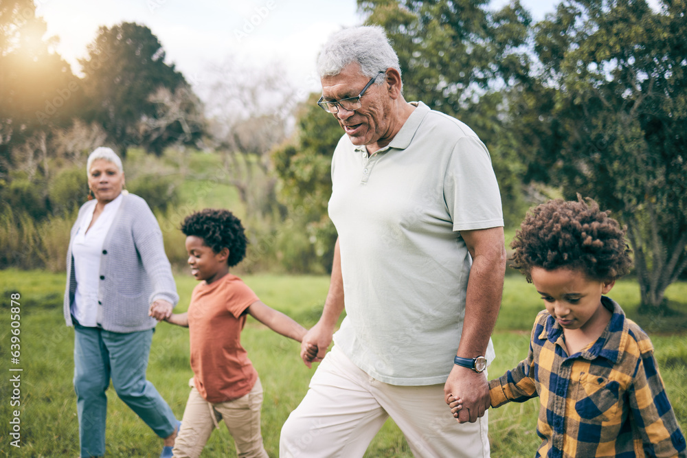 Park, grandparents and children holding hands while walking as a family together in retirement. Seni