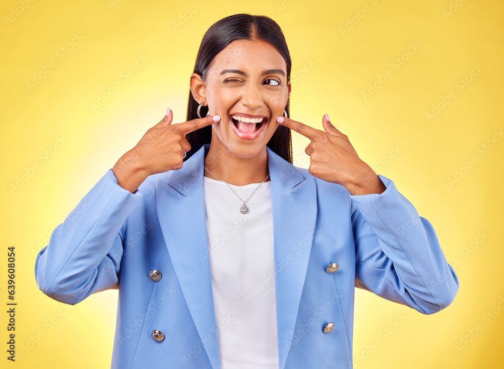 Fingers on cheek, smile and a happy woman in studio for positive attitude, dimples and emoji. Indian