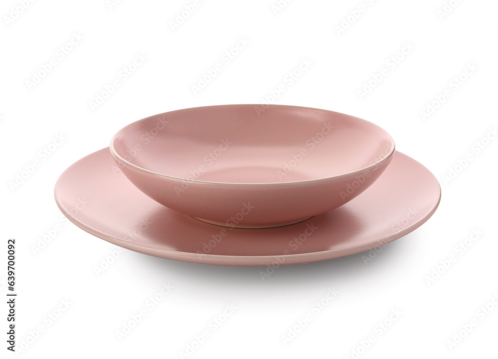 Pink ceramic plates on white background