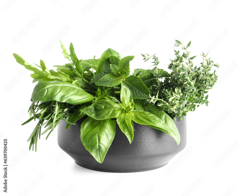 Bowl with fresh herbs isolated on white background