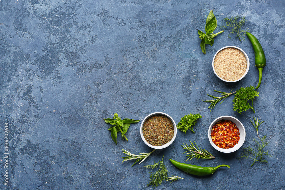 Composition with spices and herbs on color background