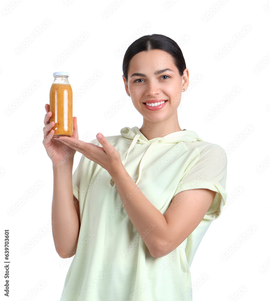 Sporty young woman with healthy smoothie on white background