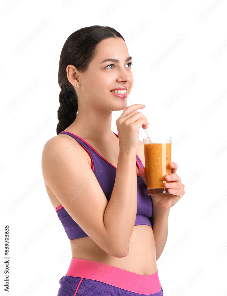 Sporty young woman with healthy smoothie on white background