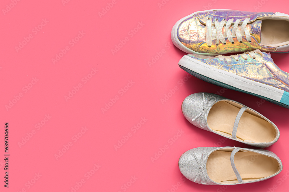 Stylish childs shoes on pink background