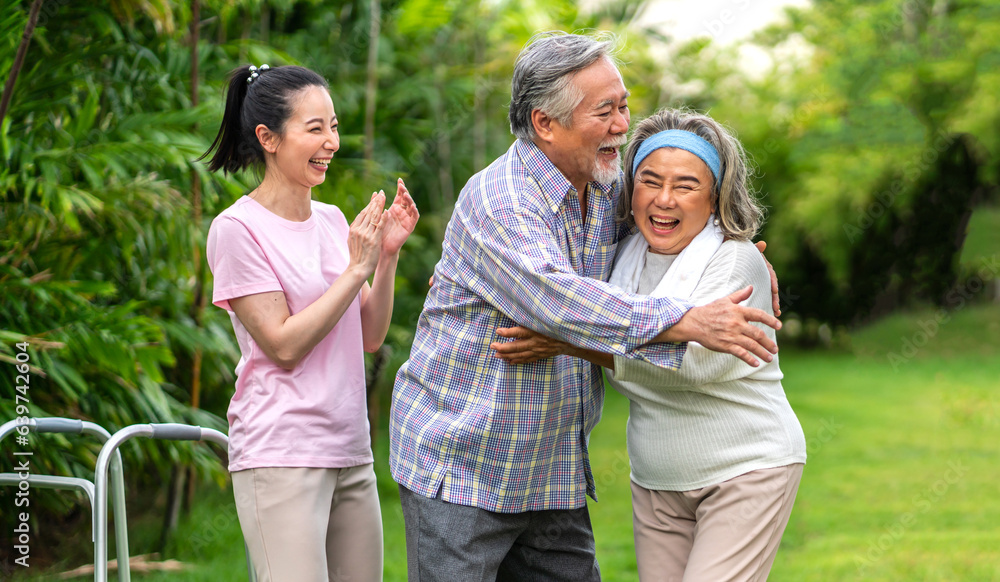 Portrait enjoy happy smiling love asian family.Senior mature father hug with elderly mother and youn