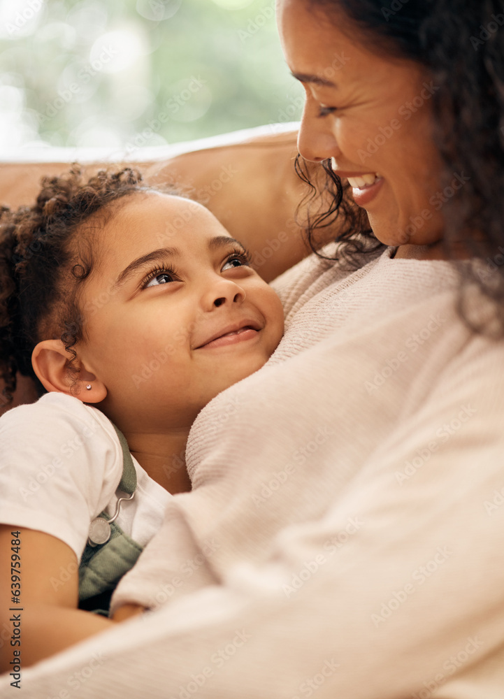 Love, woman and child embrace on sofa, bonding and smile together in living room of home. Relax, hug