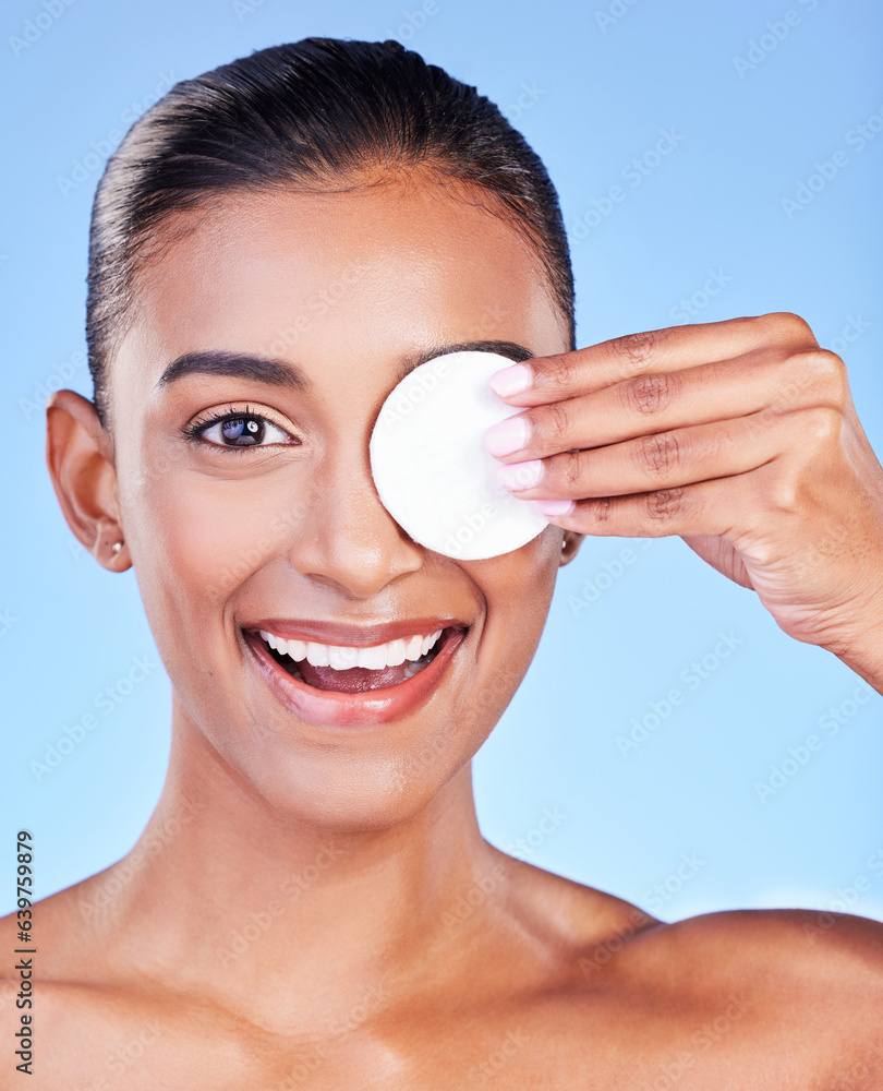 Portrait, woman and cotton pad on eyes for healthy skincare, cosmetics or smile on blue background i