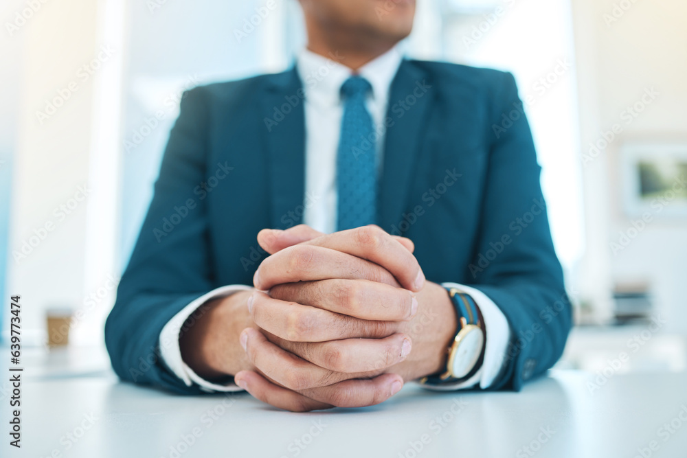 Hands, business and a man waiting in the boardroom of a professional office in a corporate suit clos