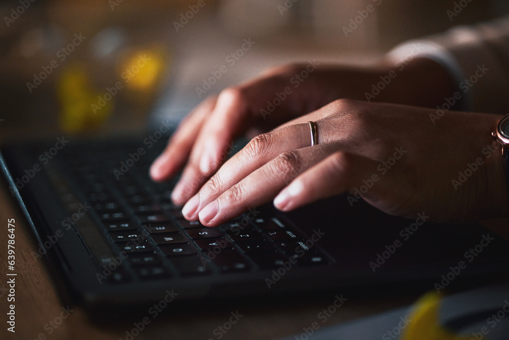 Laptop, hands typing and closeup of keyboard at table, research and working late on deadline at nigh