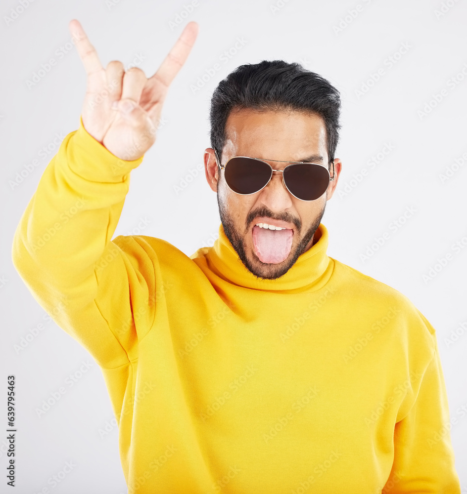 Man, horns and hand with sunglasses, studio portrait and rock icon for gesture, clothes and white ba