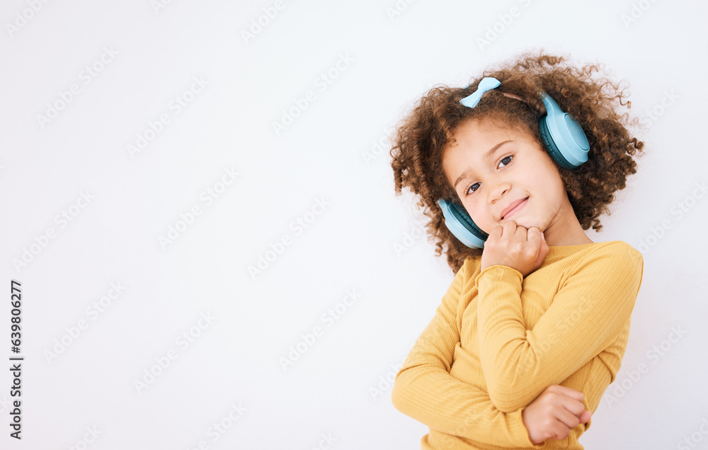 Girl child, portrait and headphones and listening to music with smile isolated on white background. 