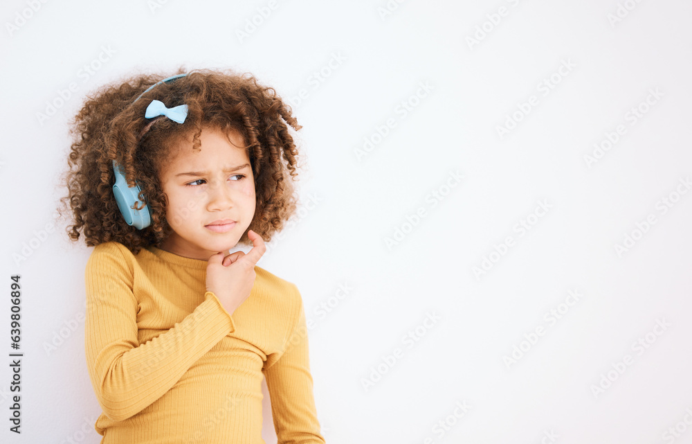 Thinking, problem and child with headphones on white background for planning, solution or music. Moc