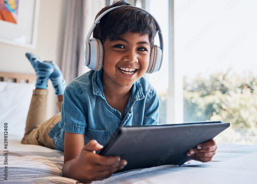 Boy, tablet and headphones on bed, portrait or smile for streaming subscription, movie or video to r