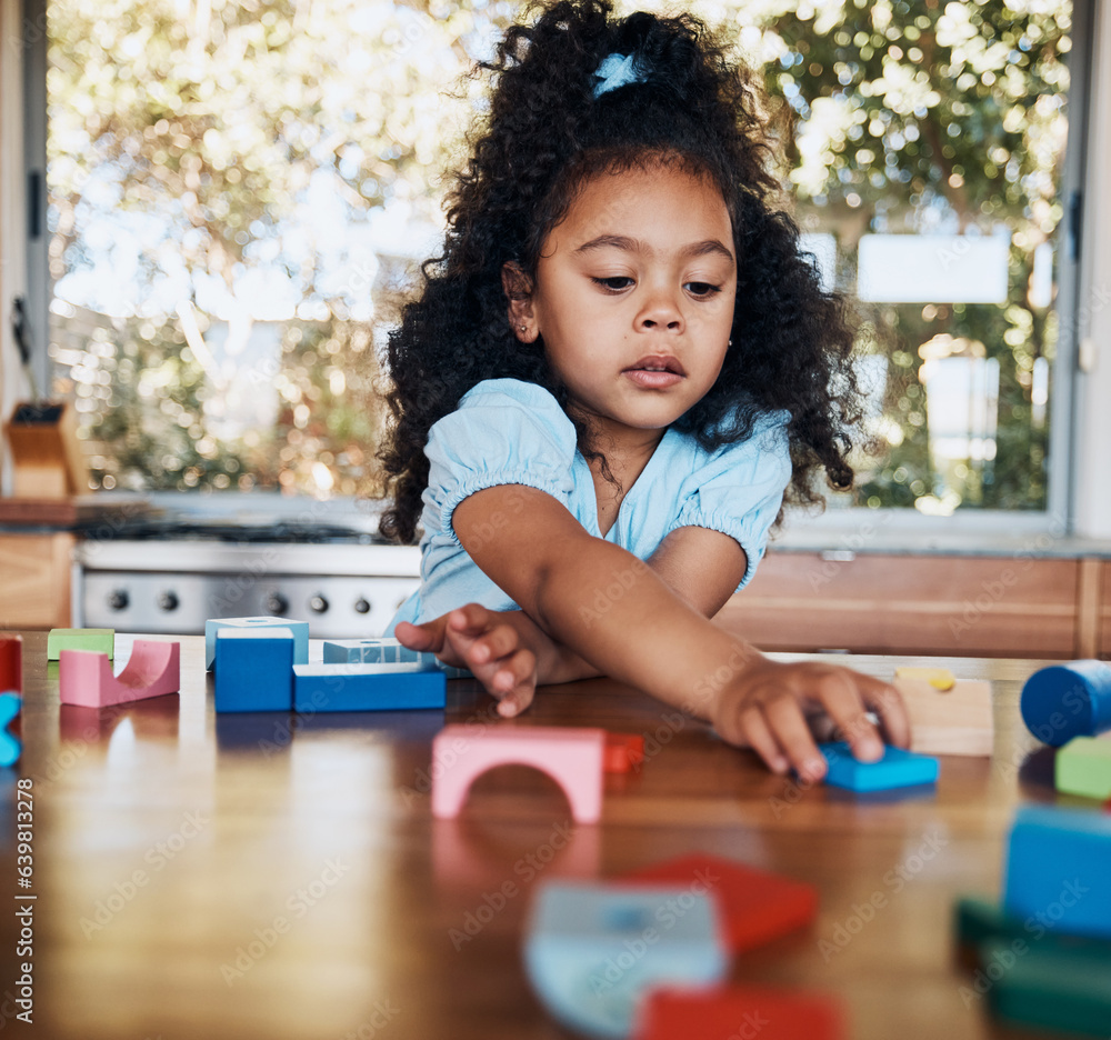 Girl, child and learning with building blocks in home for education, development and playing puzzle 