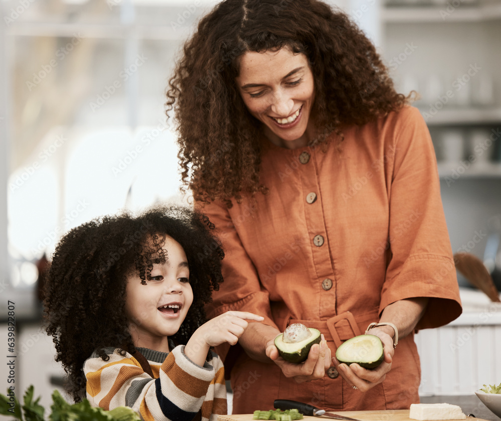 Family, avocado and a mother cooking with her daughter in the kitchen of their home together for nut