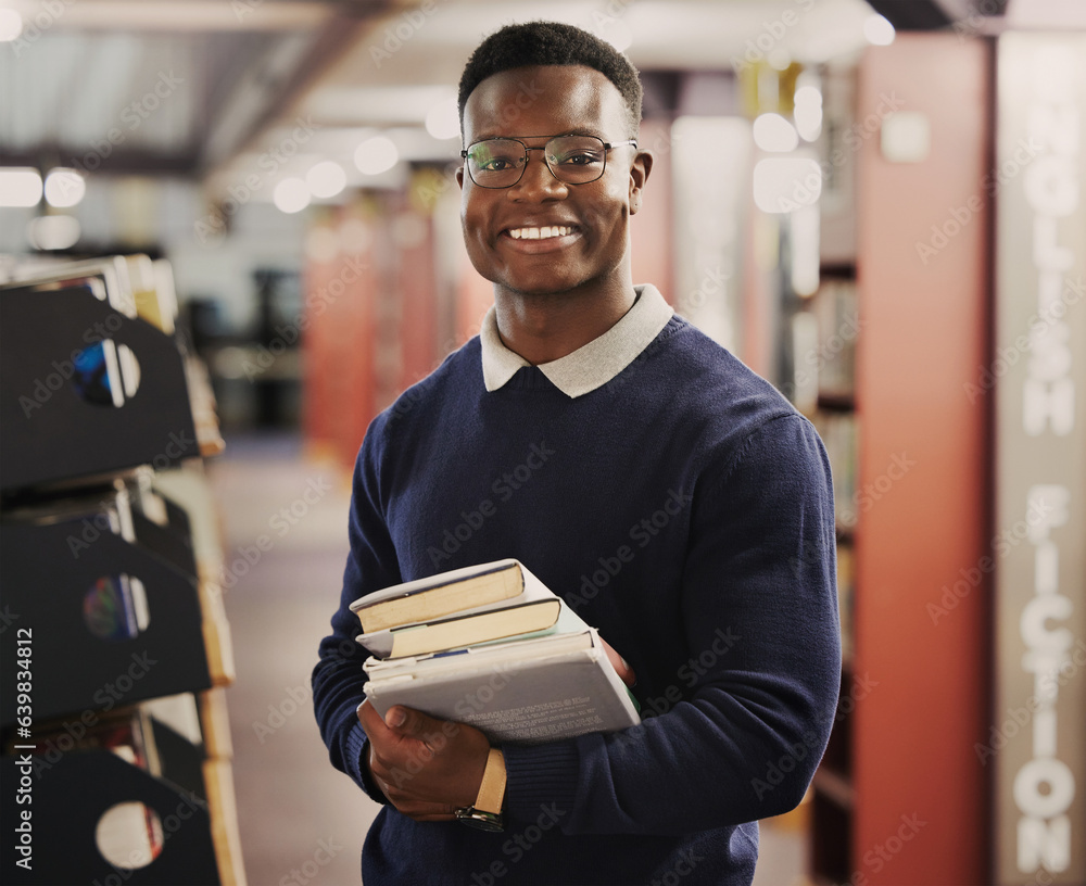 Student, university and portrait of black man in library for learning, education and reading books. 