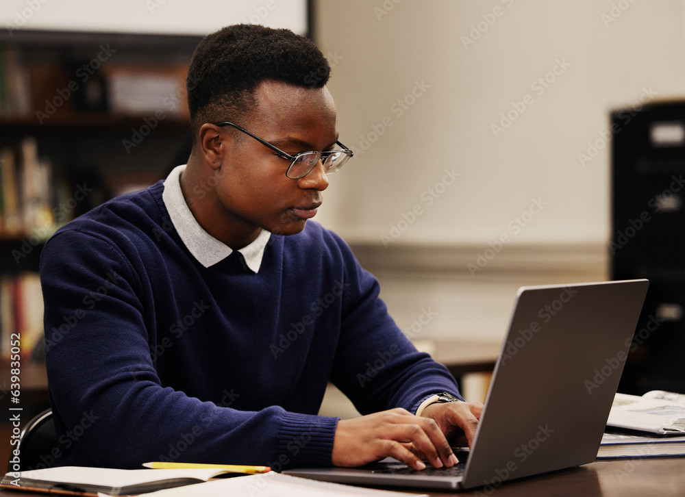 Student, learning and black man typing on a laptop in university or college campus working on assign