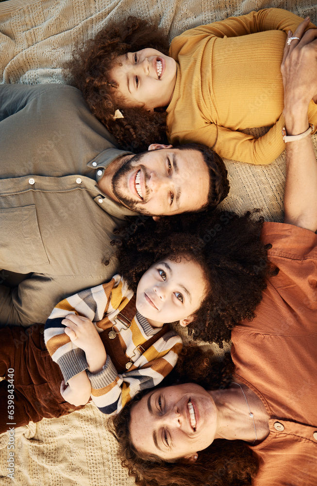 Face, family and top view of children and parents lying down together, love and happiness with bondi