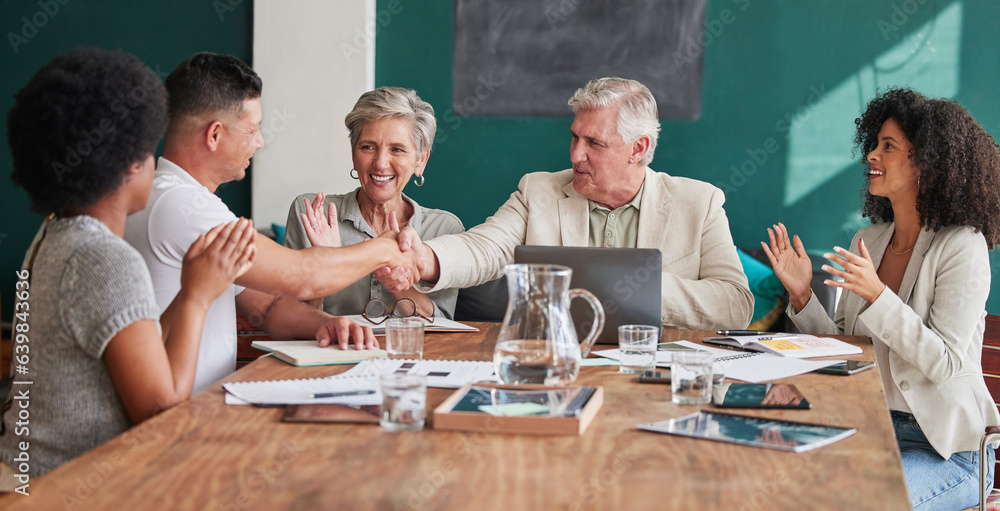 Applause, success and bonus with business people shaking hands in an office during a meeting. Promot