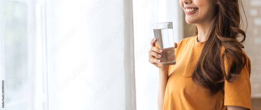 Portrait asian beauty body slim woman drinking water from a bottle while relax and feeling fresh, re