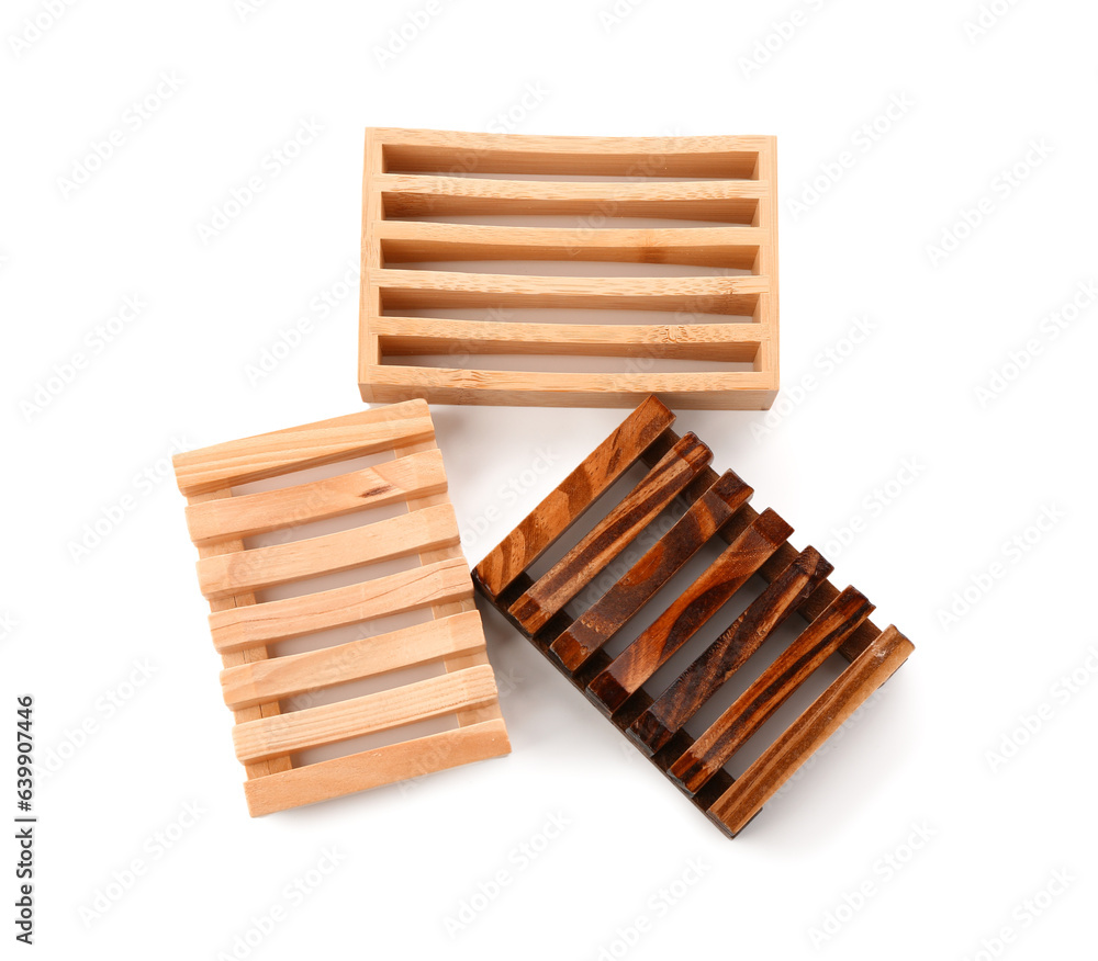 Set of wooden soap dishes isolated on white background