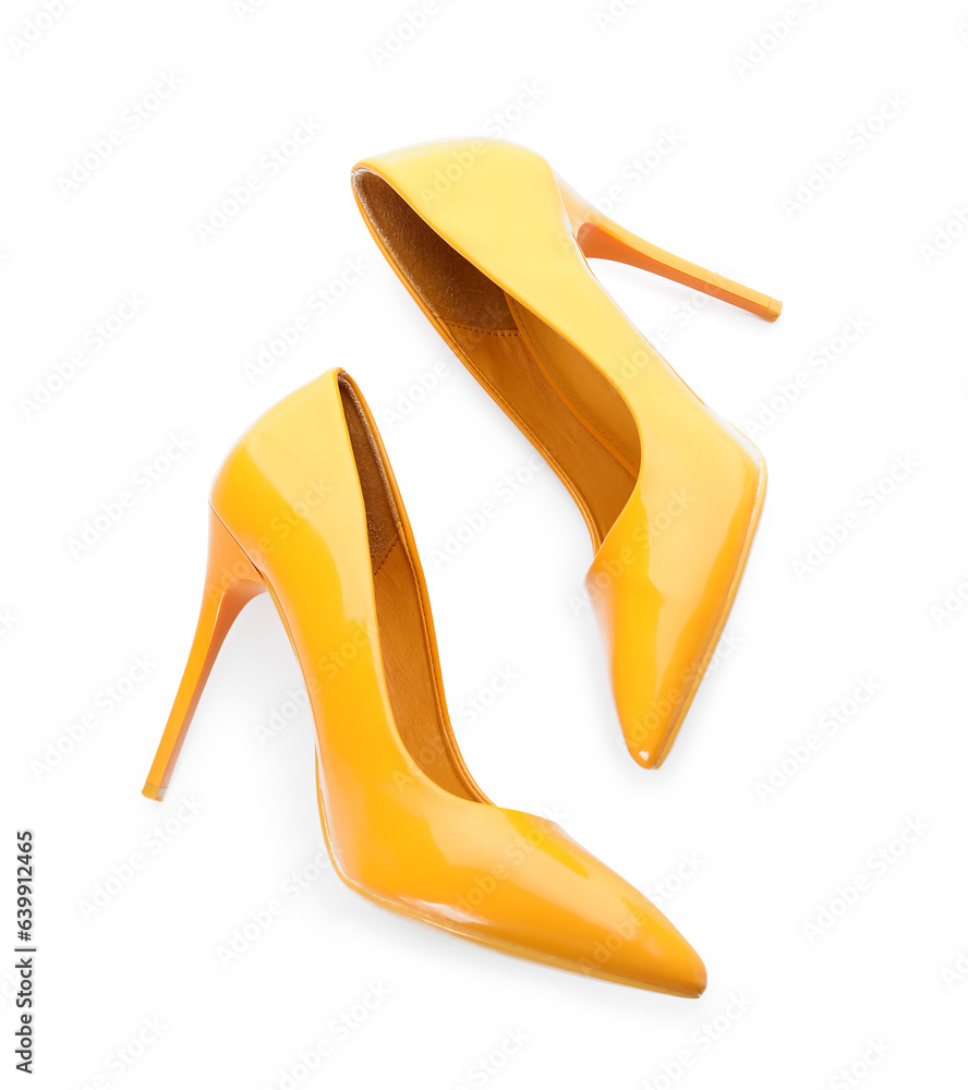 Stylish yellow high heels on white background