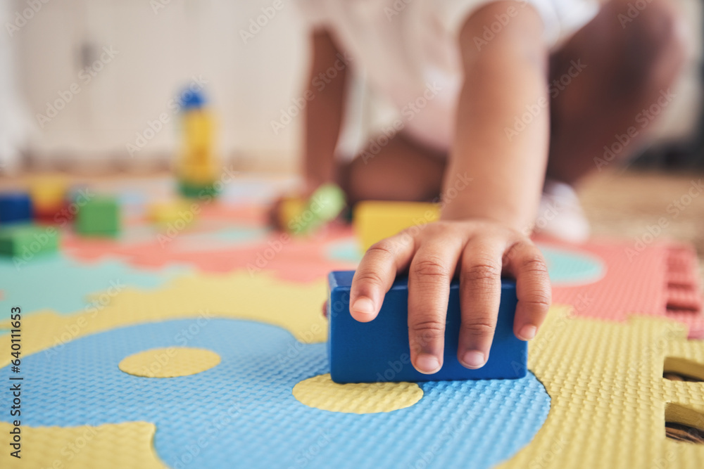 Building blocks, hands and toddler at daycare with development on number carpet and ground. Learning