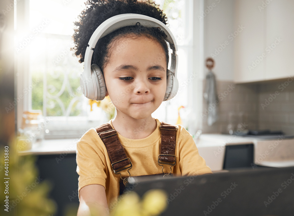 Tablet, headphones and kid in online education in home, elearning or homeschool in kitchen. Serious,