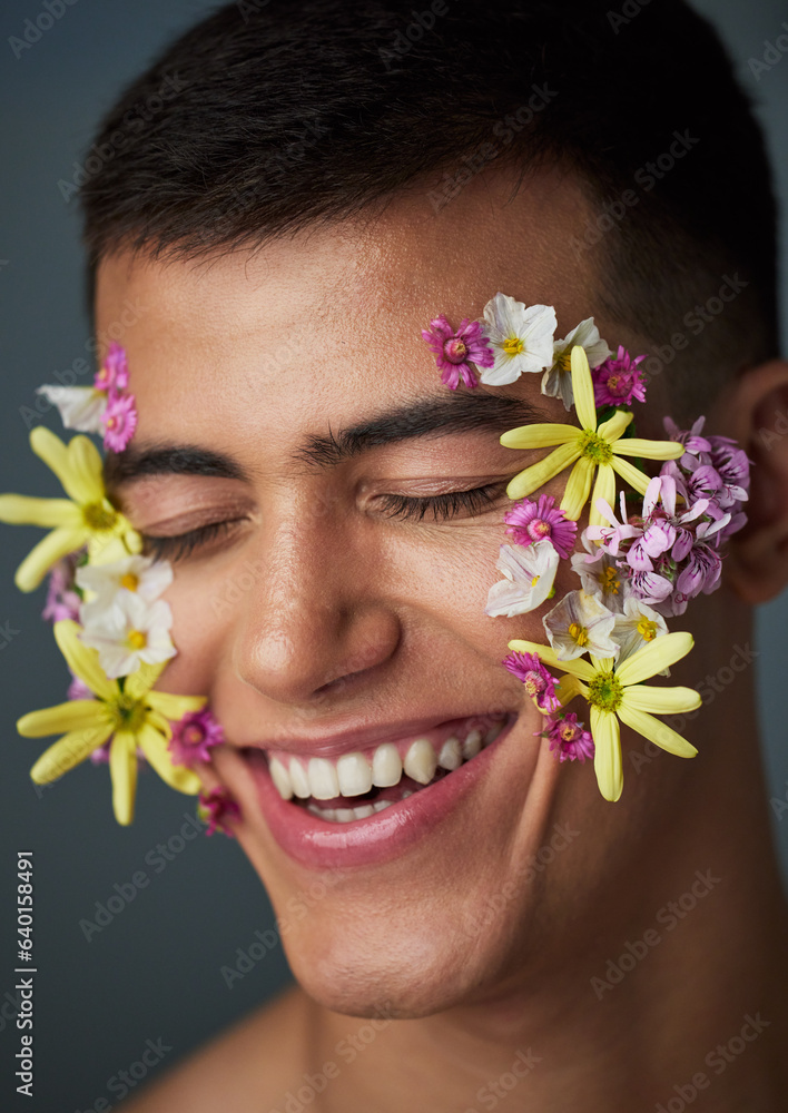 Face, man and smile, flowers and beauty, natural cosmetics and headshot with art deco isolated on st